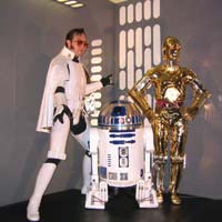 Ken the Elvis Trooper poses with R2-D2 and C-3PO at Star Wars Celebration III in 2005